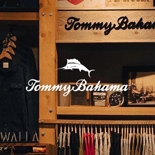 Wooden shelving with handing men's clothing and Tommy Bahama logo overlayed