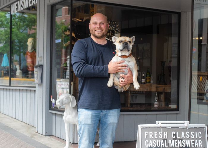 Store owner Leon and dog Karl outside NYLA Fresh Thread's Nanaimo menswear store