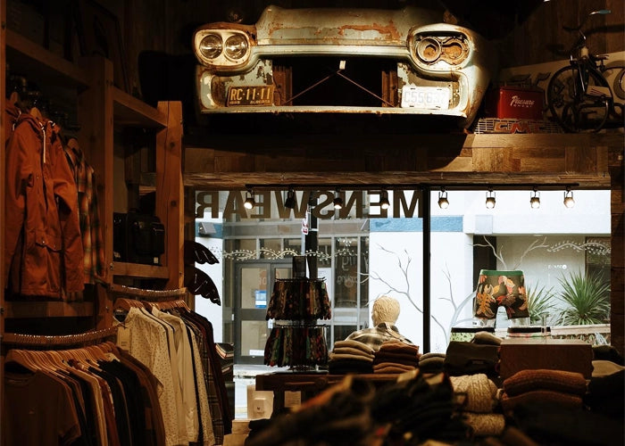 Vintage car feature above men's clothing inside NYLA Fresh Thread's Nanaimo store